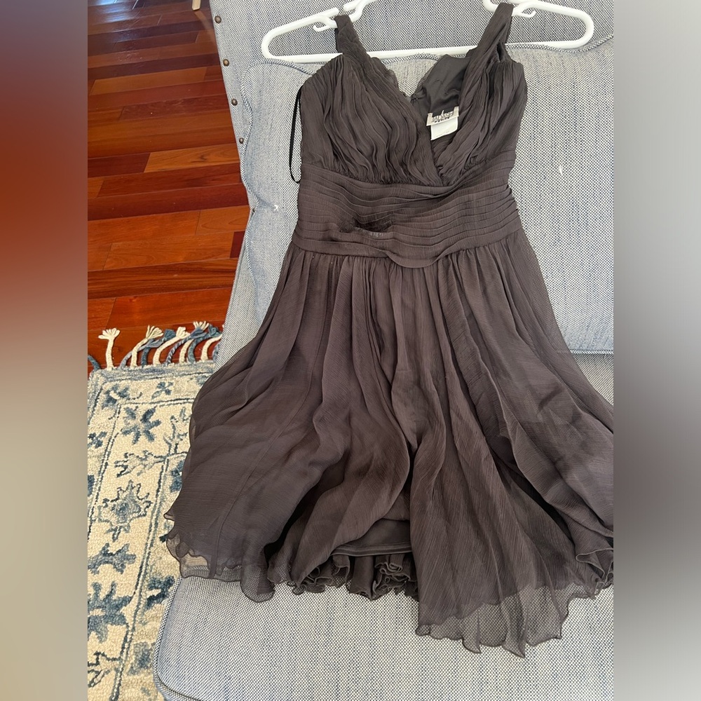 Gauze pleated brown dress with zipper at back.
